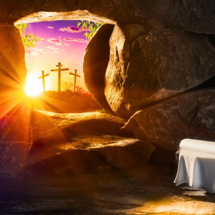 the sun is shining through a cave with three crosses on it and a table in front