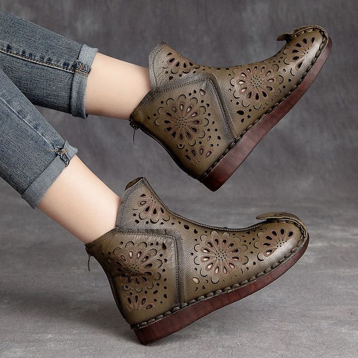 a pair of women's shoes with holes on the upper and lower part of them