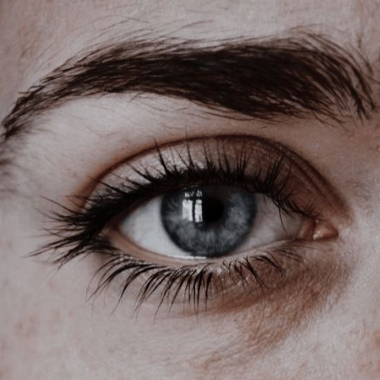 a man with blue eyes looking at the camera