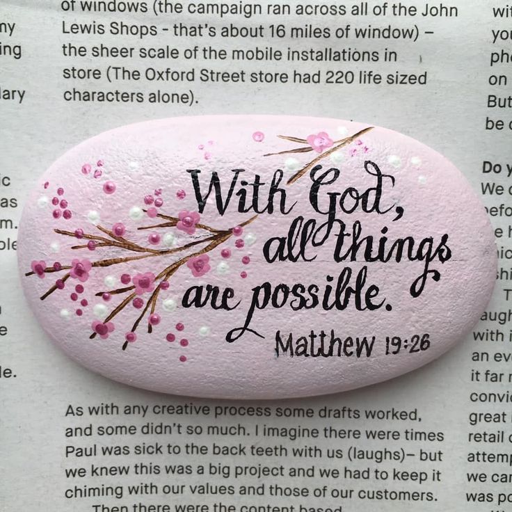 a pink rock with the words, with god all things are possible