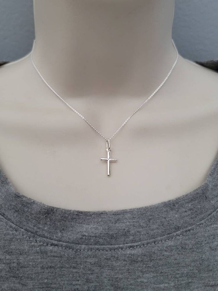 little cross necklace, sterling silver simple cross with chain,  cross charm, minimalist cross necklace, religious gift Small, Genuine  .925 Italian Sterling Silver Cross Necklace.  Sterling Silver small Cross Pendant measures 1 inch (with bail)  Sterling Silver .08mm Cable or Box Chain, choose style & length at checkout  Arrives in a Beautiful Necklace Gift Box See More Of My Shop Here: http://www.etsy.com/shop/ForeverMemoryDesigns Silver Cross Jewelry, Cross Necklace Simple, Cross Jewelry Necklace, Mens Chain Bracelet, Necklace Gift Box, Sterling Silver Cross Necklace, Simple Cross, Drop Pendant Necklace, Cross Jewelry