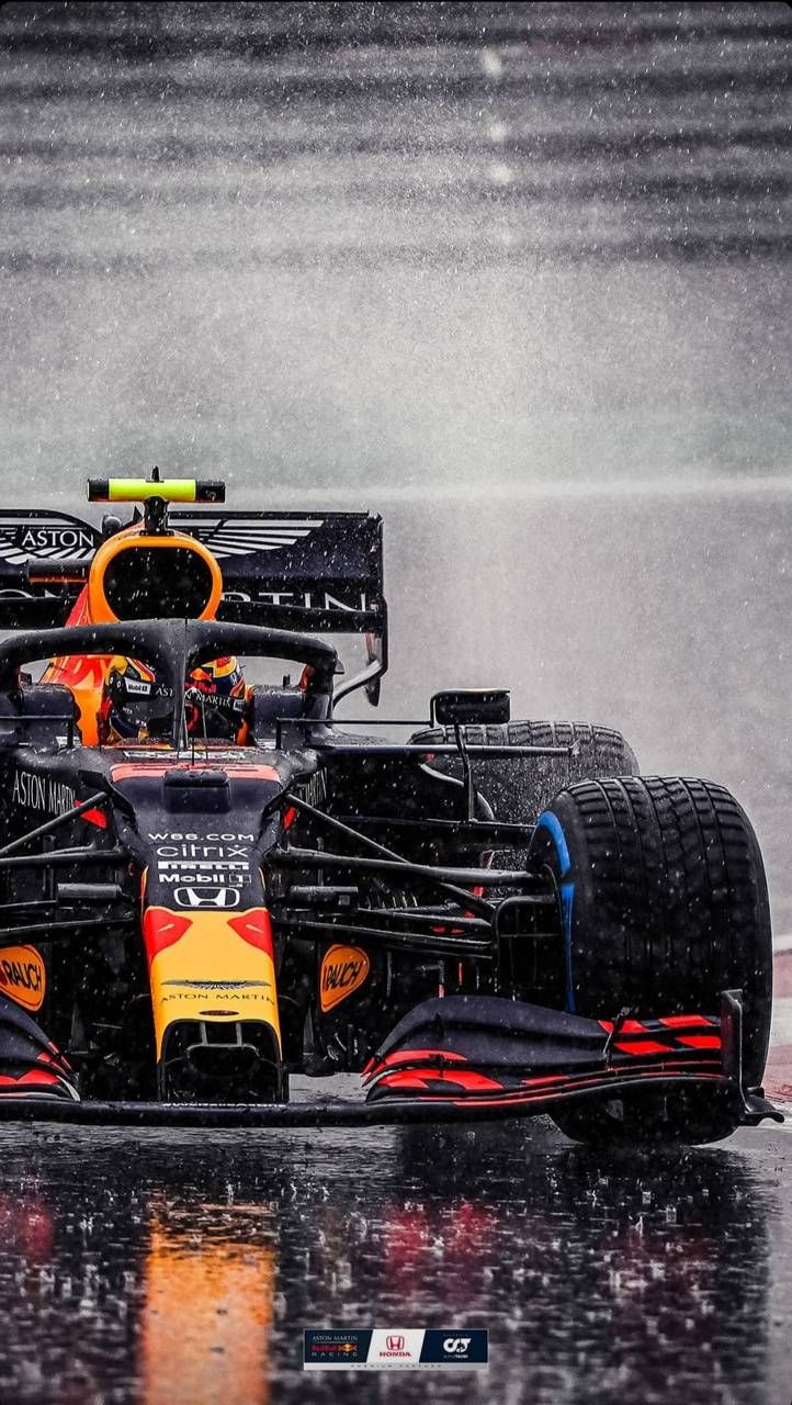 a red bull racing car in the rain