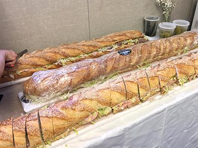 two long sandwiches are sitting on a table