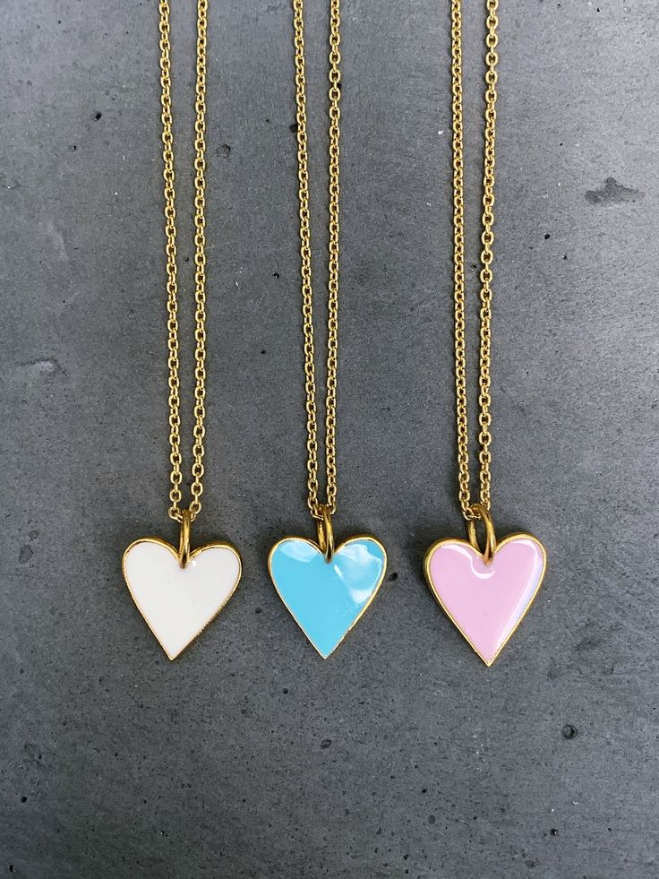 Sterling vermeil enamel heart charm necklace. Necklace is 18" in length. 18KT gold plate over sterling silver on heart charm and cable chain. Heart charm measures 14 mm x 17 mm. Available in three colors, choose from drop down menu. Follow us on instagram @pennyweightsjewelry! Heart-shaped Enamel Charms Necklaces, Heart-shaped Enamel Charms Necklace, Gold Heart-shaped Enamel Necklace, Enamel Heart Charms Necklace, Heart-shaped Gold Enamel Necklace, Gold Enamel Charm Necklace With Heart Charm, Gold Enamel Heart Charm Necklace, Chain Heart, Heart Charm Necklace