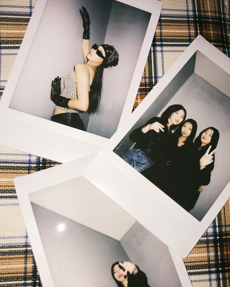 four polaroid photos of three women in black outfits and one is holding her hand up