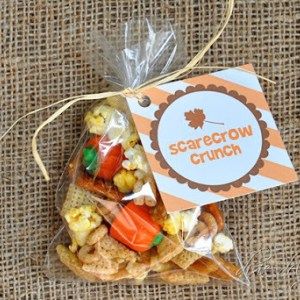 a bag filled with corn and carrots on top of a burlack covered table