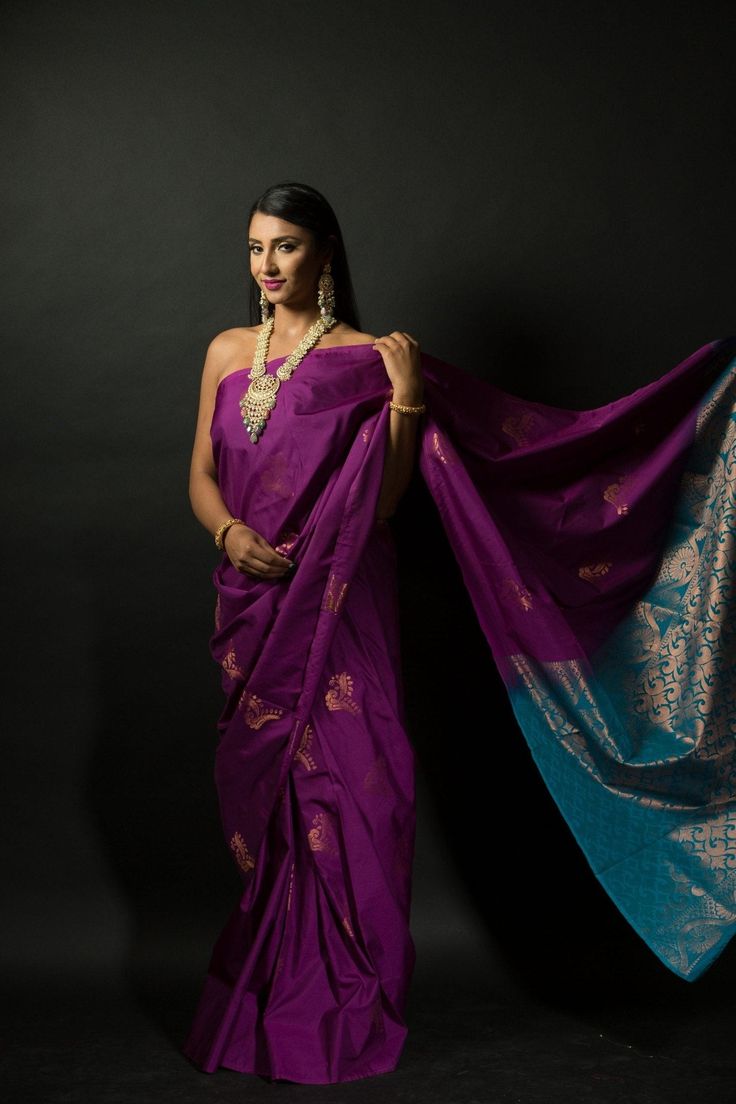 Get ready to turn heads with this stunning silk saree! The beautiful purple and azure blue color combination of this Silk saree will make a strong statement no matter where you go. Intricate gold embroidery work along the pallu adds a bit of traditional flair that makes this saree perfect for special occasions. Whether you're attending a wedding or hitting up an office party, this classic yet eye-catching look is sure to make your mark on any setting. Plus, you'll stay comfortable since the lush Elegant Blue Pre-draped Saree For Puja, Bollywood Style Purple Handloom Pre-draped Saree, Purple Pre-draped Saree For Puja, Purple Katan Silk Pre-draped Saree With Zari Work, Traditional Purple Tissue Silk Pre-draped Saree, Purple Paithani Silk Pre-draped Saree For Wedding, Purple Katan Silk Pre-draped Saree With Cutdana, Purple Pre-draped Saree With Traditional Pallu, Purple Silk Handloom Pre-draped Saree