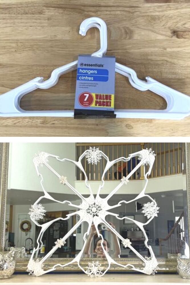 a white plastic hanger sitting on top of a wooden table next to a mirror