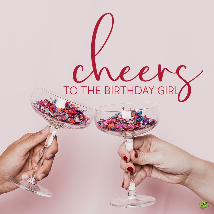 two hands holding wine glasses filled with confetti and sprinkles that say cheers to the birthday girl