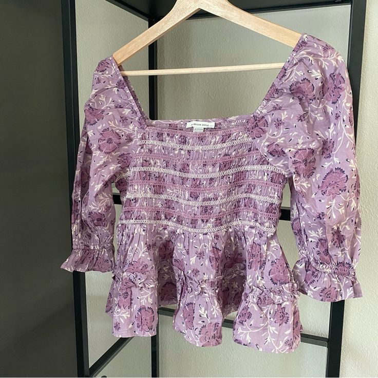 Nwt American Eagle Floral Smocked Top Color: Purple Multi Size: Xsmall Smocked With Flowy Bottom Can Be Worn On Or Off Shoulder Ptp Approx 13.5” Shoulder To Hem Where It’s Hanging Approx 19” Fitted Bohemian Smocked Top For Brunch, Spring Peasant Smocked Top, Spring Purple Smocked Top, Peasant Smocked Top With Puff Sleeves, Fitted Peasant Smocked Top With Puff Sleeves, Fitted Bohemian Smocked Top, Summer Purple Smocked Top With Smocked Bodice, Purple Smocked Top With Smocked Bodice For Summer, Cotton Smocked Top With Puff Sleeves And Floral Print