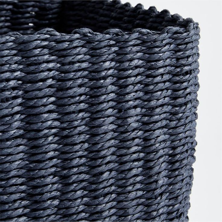 a close up view of a basket that is made out of dark blue woven material