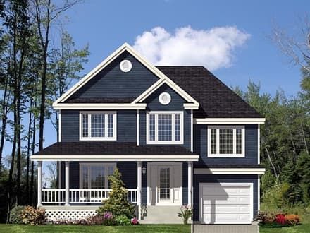 a large blue house with white trim and windows