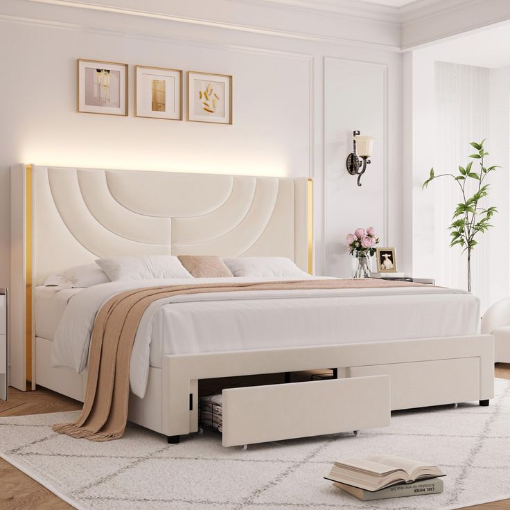 a white bed sitting in a bedroom on top of a hard wood floor