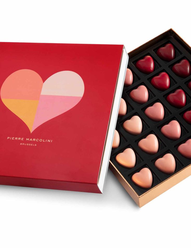 heart shaped chocolates in a red box on a white background