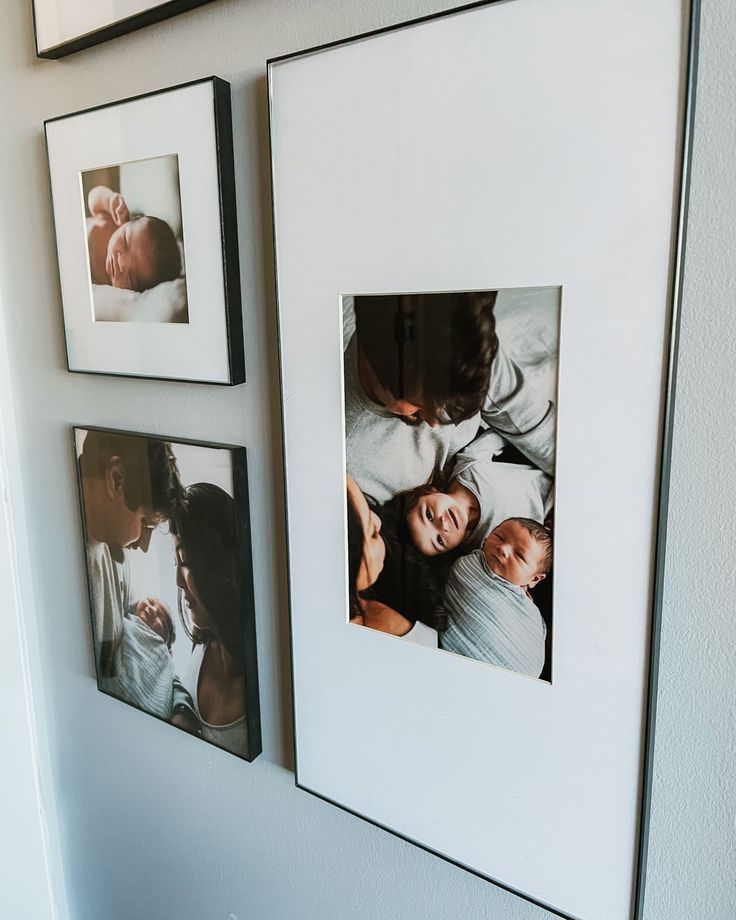 three framed photos hanging on the wall with family pictures in them and one is holding a baby