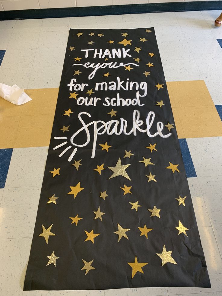 a black banner with gold stars on it that says thank you for making our school sparkle