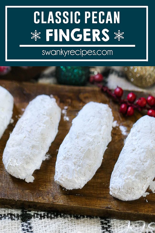 four pieces of bread sitting on top of a wooden cutting board next to christmas decorations