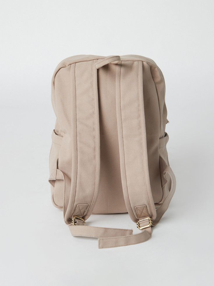 Need a backpack that's both sustainable and practical for college, school everyday use or outdoor activities? Our Earth Backpack is perfect for you. Our spacious and durable Earth Backpack is the workhorse of our line, built for everyday carry with heavy-duty certified organic cotton canvas. The generous main compartment is divided with a no-fuss sleeve for your laptop and one small interior pocket to keep things organized. Two water bottle sleeves and the large zippered exterior pocket keep hyd Functional Canvas Backpack For Back To School, Large Capacity Laptop Backpack, School Leather Backpack With Adjustable Straps, Backpack With Adjustable Straps For Daily Use, Standard Backpack With Adjustable Straps For Daily Use, Backpack With Adjustable Straps For Back To School, Versatile Softback Backpack For Back To School, Versatile Backpack With Adjustable Straps For Back To School, Student Backpack With Adjustable Straps In Canvas