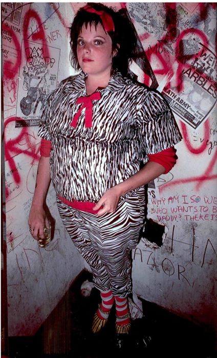 a woman dressed up in an animal print outfit