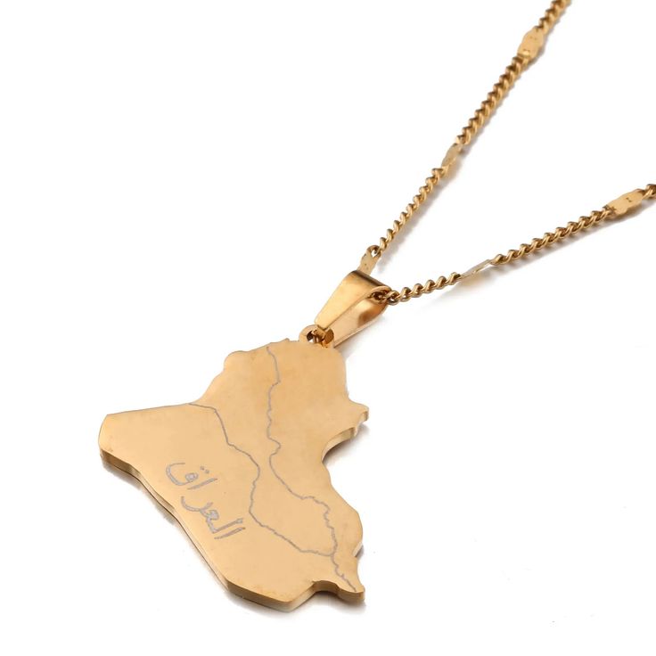 a gold necklace with the shape of africa on it