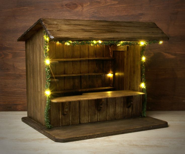 an old wooden shelf with lights on it