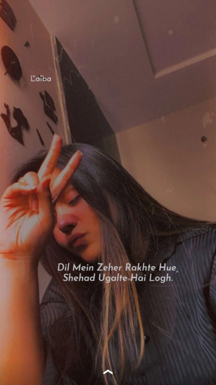 a woman with long hair holding her hands up in front of her face and the words, dil mein zeher rahte hule shehad - ha lough