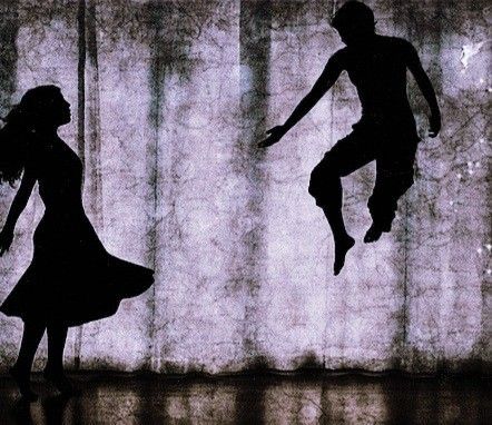 the silhouettes of two people jumping in the air