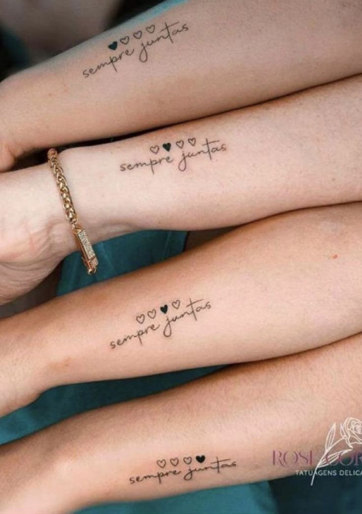 three girls with matching tattoos on their arms and wrist, one has the word love in cursive writing