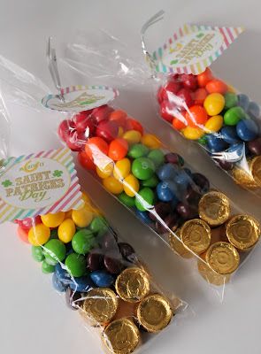 three bags filled with candy and gold coins