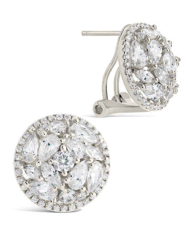 These fun, celebrity-inspired Zara Circle Studs will make you feel like a movie star! Featuring a unique CZ stone design, you can wear these flashy statement earrings on the red carpet and turn heads like the gorgeous A-listers you admire. Unforgettable glam, coming your way! Materials: 14K gold or rhodium plated brass, cubic zirconia Features: 0.6" stud, 1mm-5mm stones, Lead & Nickel free, hinged post back Silver Glamorous Cluster Earrings For Party, Round Cluster Earrings With Sparkling Stones For Party, Sparkling Stones Cluster Earrings For Party, Party Clip-on Earrings With Cubic Zirconia, Party Cluster Earrings With Sparkling Stones, Modern Cubic Zirconia Earrings For Party, Modern Party Earrings With Cubic Zirconia, Clip-on Cluster Earrings For Evening, Dazzling Cluster Earrings For Party