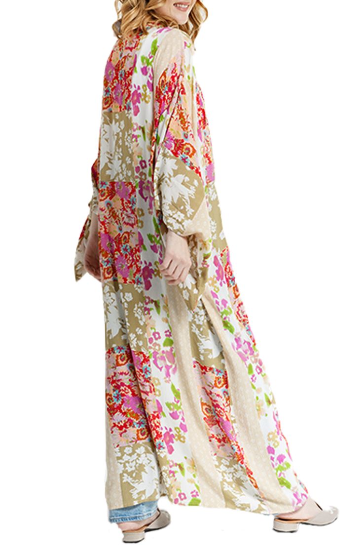 Hit the beach or kick it poolside in this flowy kaftan that features an allover floral pattern, kimono-inspired sleeves and an uneven hem. Kimono-inspired sleeves 100% rayon Hand wash, line dry Imported Floral Print Flowy Maxi Cover-up, Spring Long Sleeve Relaxed Fit Kaftan, Oversized Spring Tunic Cover-up, Spring Kaftan With Kimono Sleeves And Relaxed Fit, Flowy Long Sleeve Kimono With Floral Print, Casual Maxi Dress With Floral Print And Kimono Sleeves, Spring Floral Print V-neck Kaftan, Casual Spring Kaftan With Kimono Sleeves, Spring Daywear Long Sleeve Kaftan