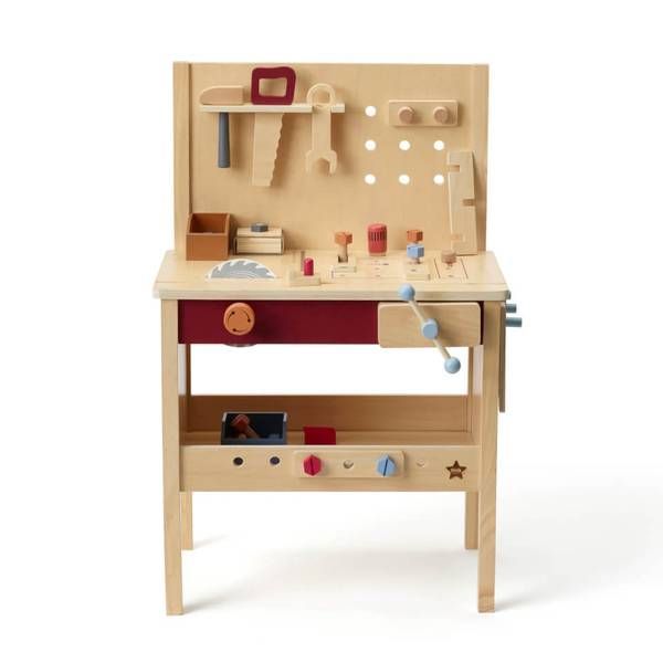 a wooden toy workbench with various tools