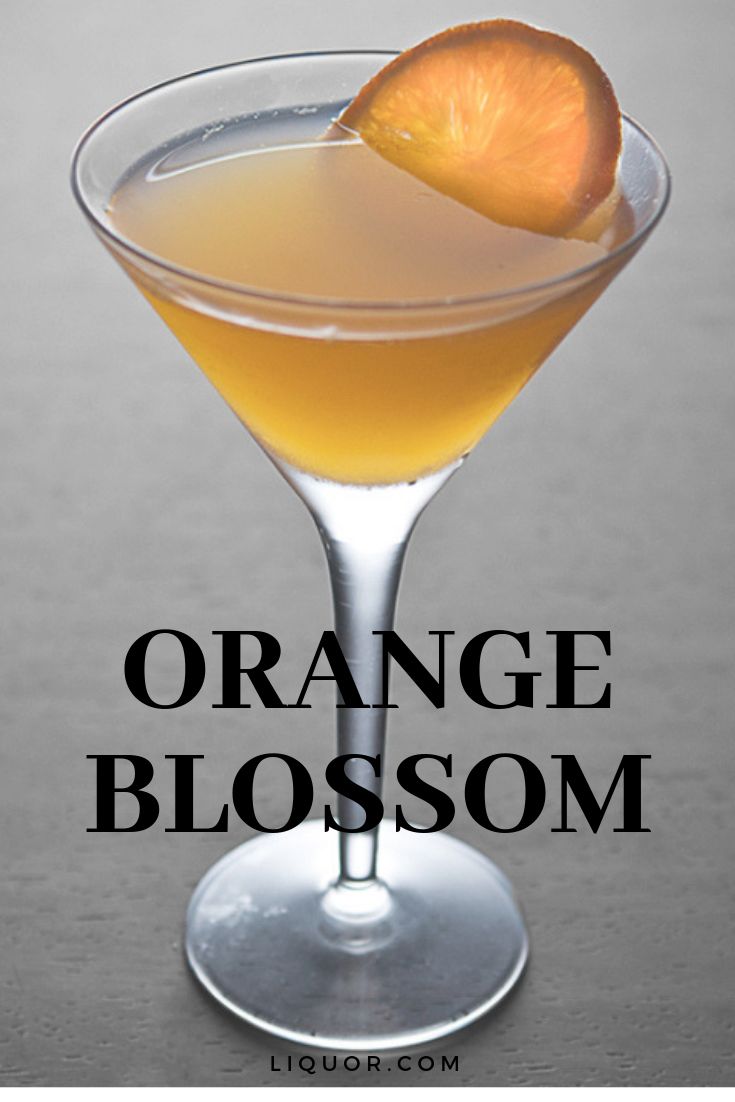 an orange blossom cocktail in a martini glass with the words orange blossom on it's side