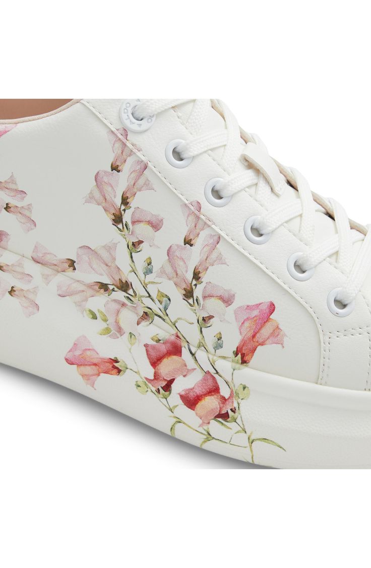 Dreamy watercolor flowers bloom across the midsole and sidewall of this romantic low-top platform sneaker cushioned by dual-density foam for all-day comfort. Cushioned footbed with arch support Pillow Walk™ comfort technology Synthetic upper/recycled-polyester textile lining/rubber and leather sole Imported Casual Low-top Floral Print Sneakers, Sporty Floral Print Sneakers With Round Toe, Spring Lace-up Platform Sneakers With Speckled Midsole, Spring Floral Print Sneakers With Round Toe, Floral Print Round Toe Sneakers For Spring, Spring Floral Print Round Toe Sneakers, Sporty White Sneakers With Floral Print, Spring Lace-up Platform Sneakers With Cushioned Footbed, Pink Lace-up Sneakers With Floral Print