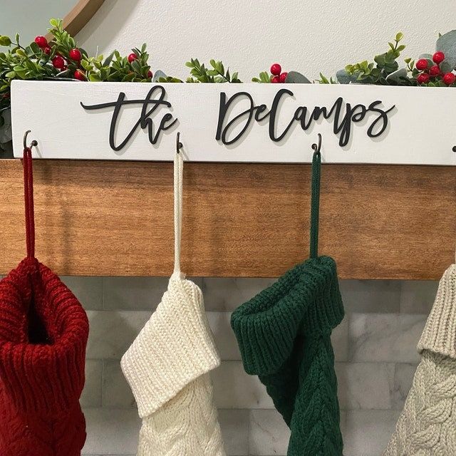 three stockings hanging from a wall with the words, the belgars on it