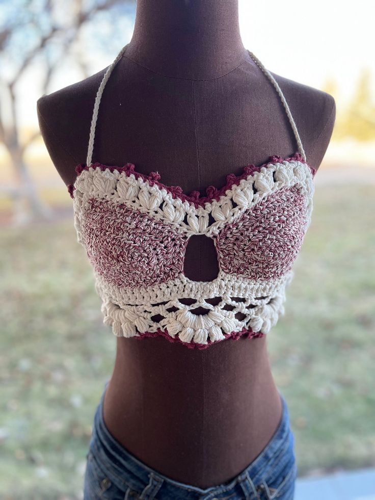 Boho Bliss crochet bralette in red and cream. Pair with your favorite shorts or skirt and throw your favorite flannel over it! Ties in the back making it easily adjustable. One size fits most. Message shop for custom colors! Pattern by Cozy Creative Crochet. Beach Lace Crop Top With Built-in Bra, Beach Lace Crop Top Bra Friendly, Beach Lace Crop Top, Bra Friendly, Beach Crop Top In Lace That Is Bra Friendly, Beach-ready Bra-friendly Lace Crop Top, Beige Fitted Bra For Beach, Fitted Beige Bra For Beach, Bohemian Crop Top With Built-in Bra For Festivals, Beige Crochet Lace Cotton Crop Top