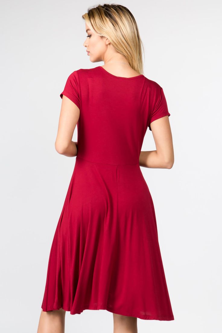 Cocktails? Date night? Sunday brunch? Cover all your upcoming events with this sexy surplice short sleeve dress! Featuring soft stretchy fabric, a faux wrap-around style bodice, a flowy high empire waist silhouette, and an above the knee hem makes this dress perfect for any occasion. Surplice front V-neckline Short sleeves Faux-wrap front bodice Flowy A-line dress Soft and stretchy Comfortable material Above the knee hem 95% Polyester, 5% Spandex Imported Model StatsMODEL: Color - NavyHEIGHT: 5' Summer V-neck Dress With Flattering Cut, Flirty Fitted V-neck Wrap Dress, Fitted V-neck Plain Midi Dress, Cap Sleeve Short Sleeve Dress For Summer Party, Summer Party Short Sleeve Dress With Cap Sleeves, Flattering Solid Color V-neck Dress, Fitted Knee-length Midi Dress With Faux Wrap, Elegant V-neck Short Sleeve Dress, V-neck Fit And Flare Midi Dress