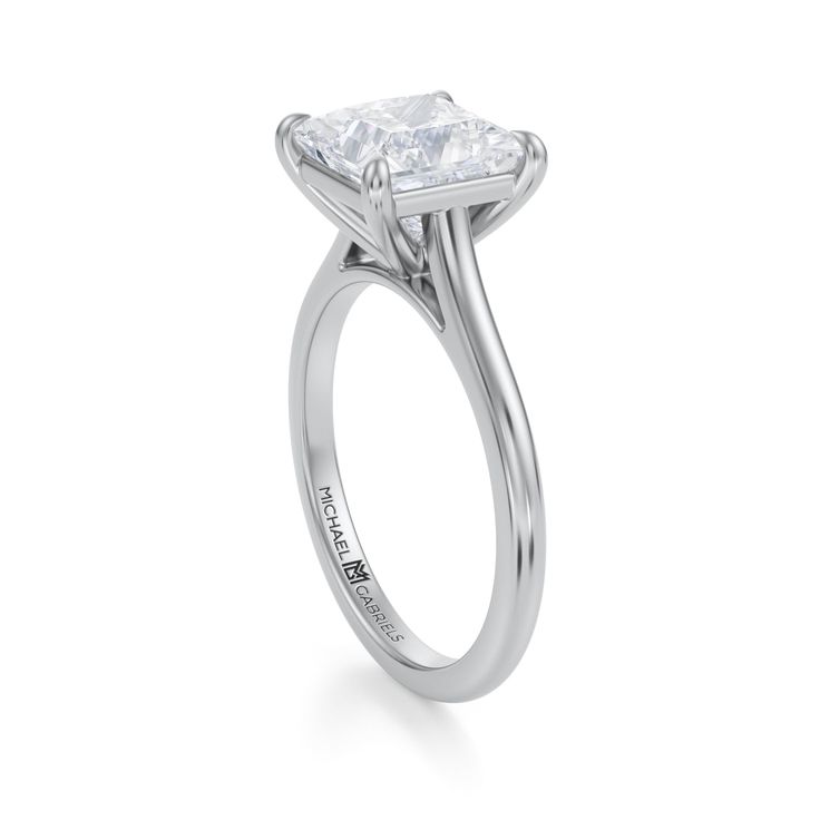 an engagement ring with a square cut diamond in the center