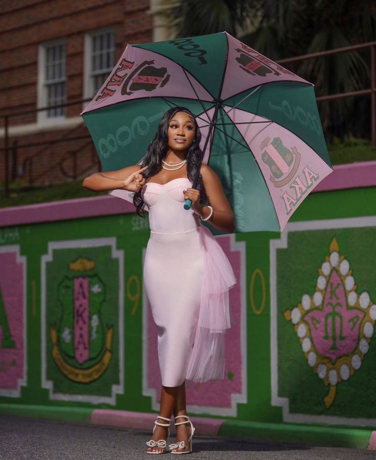 a woman in a white dress holding an umbrella