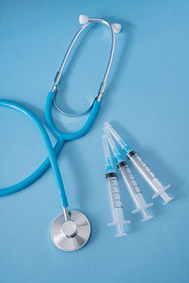 three sys and a stethoscope on a blue background