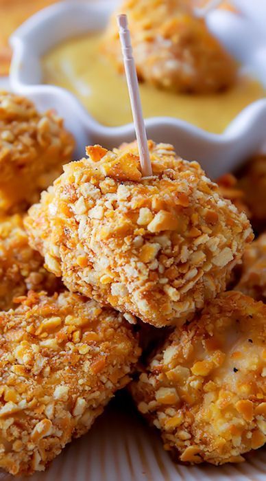 some fried food is on a plate with dipping sauce