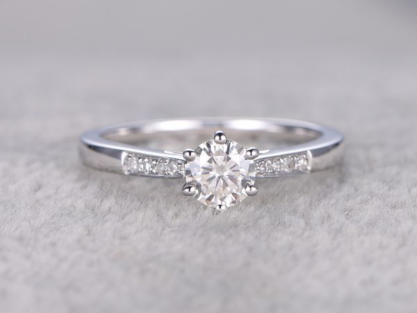 a white gold engagement ring with diamonds on it