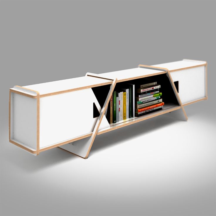 a white book shelf with books on it and two doors open to reveal the shelves