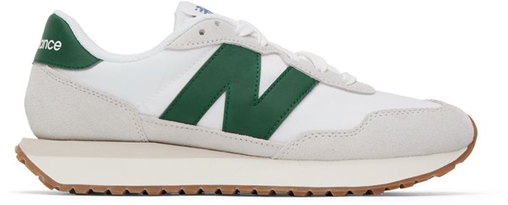 Low-top paneled canvas, mesh, and suede sneakers in white and gray. · Lace-up closure · Textile logo patch at padded tongue · Padded collar · Leather logo appliqué in green at sides · Logo printed at green leather heel tab · Mesh lining · EVA foam rubber midsole · Treaded rubber outsole Supplier color: Nimbus cloud Green Canvas Sneakers With Contrast Sole, Casual New Balance Sneakers With Logo Patch, Sporty Canvas Sneakers With Logo Patch, Green Sneakers With Logo Patch And Round Toe, Green Sneakers With Logo Patch For Streetwear, Green Round Toe Sneakers With Logo Patch, Green Low-top Sneakers With Logo Patch, Green Logo Patch Sneakers For Streetwear, New Balance Leather Sneakers With Logo Patch