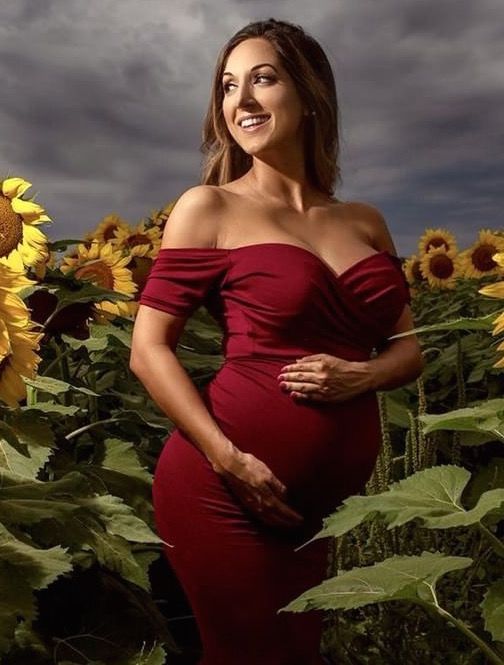 Maternity shoot perfection in a field of sunflowers! This burgundy Short-Sleeve Off the Shoulder Sweetheart Maternity Gown is the perfect photoshoot, baby shower, wedding or special event maternity gown.  maternity gown, maternity style, maternity fashion, baby, baby bump, mom to be, mommy, maternity shoot, baby shower, maternity wedding dress, baby shower gown, gender reveal, bumpie.  #maternitygown #maternityshoot #sunflower #redgown #babybump #momtobe #maternity #pregnant Fitted Off-shoulder Maternity Dress, Fitted Maternity Dress For Bridesmaids, Fitted Off-shoulder Maternity Dress For Wedding, Elegant Maternity Dress With Sweetheart Neckline, Maternity Fitted Dress With Sweetheart Neckline, Maternity Dress With Sweetheart Neckline And Fitted Bodice, Fitted Maternity Dress With Sweetheart Neckline, Fitted Bodice Maternity Dress, Maternity Wedding Dress With Sweetheart Neckline