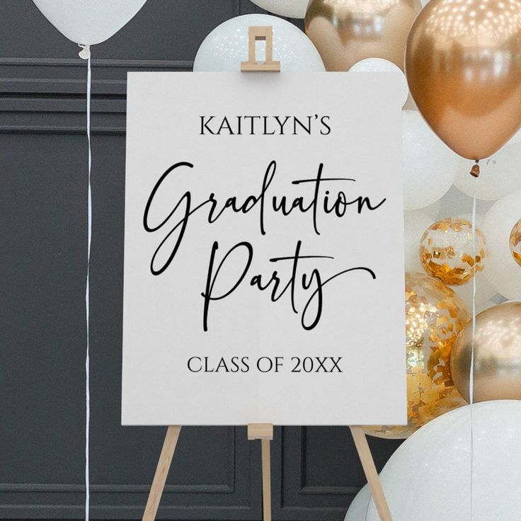 a graduation party sign surrounded by balloons