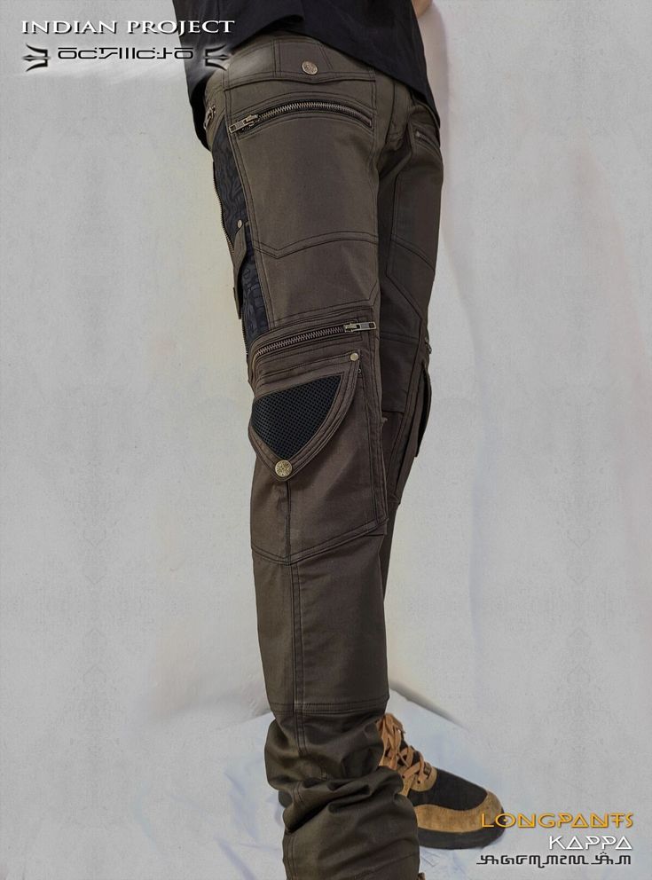 "INDIAN PROJECT Alternative Clothing Goa (2004-2023) KAPA  :: Long pant in Cotton Twill Twill Stretch fabric. 4 front pockets 4 back pockets 4 side pockets 2 \"secret pockets\" Metal buckle on side YKK ZIPPERS 2023 Collection -------------------------------------------------------------------------------------------- SIZING CHART To be sure of the size you need, please get the measure of one of your favorite pants. Get the complete waist round of your pants. XS = Complete round of your pant's Wa Black Steampunk Bottoms For Festival, Gothic Bottoms With Pockets For Festival, Techwear Pants With Pockets For Festival, Techwear Festival Pants With Pockets, Festival Techwear Pants With Pockets, Alternative Style Bottoms With Pockets For Festivals, Black Post-apocalyptic Style Bottoms For Festival, Alternative Style Festival Bottoms With Pockets, Black Post-apocalyptic Style Festival Bottoms