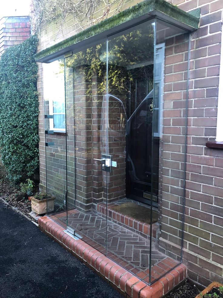 a brick building with glass doors on the outside