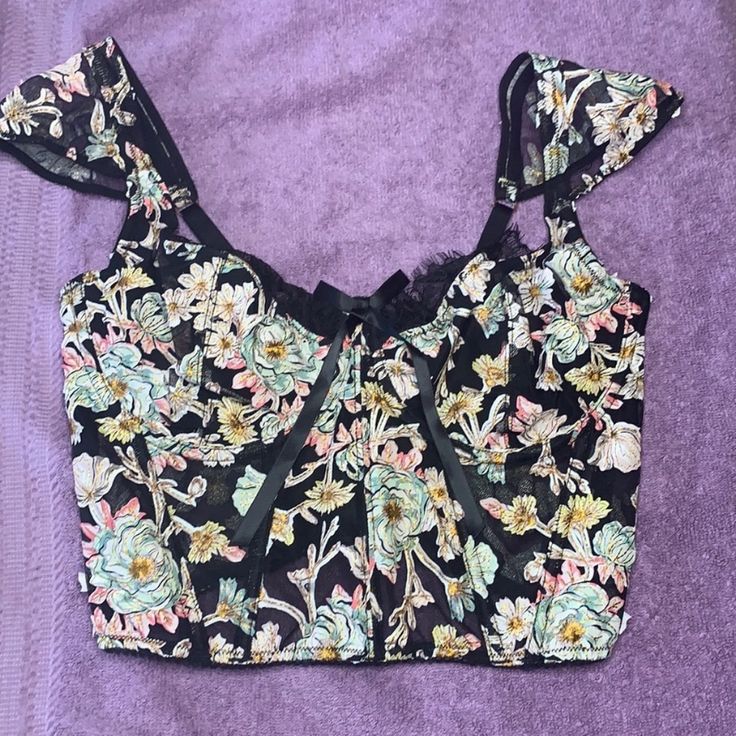 Brand New With Tags Victoria’s Secret Dream Angels Floral Bustier. Sold Out Highly Sought After Black Floral Print. Never Worn Or Tried On. Cups Have Underwire And Satin Lining But No Padding. Shoulder Straps Are Adjustable. Zips Up The Back. See Through Mesh Bodice With Boning. Comes From A Smoke Free Home. If You Have Any Questions Or Need More Pictures Please Ask! Summer Black Coquette Tops, Black Coquette Summer Tops, Coquette Black Summer Tops, Fitted Coquette Top By Victoria's Secret, Fitted Victoria's Secret Crop Top For Spring, Victoria's Secret Floral Print Summer Tops, Summer Floral Print Tops By Victoria's Secret, Victoria's Secret Fitted Cami Top, Victoria's Secret Sleeveless Coquette Top