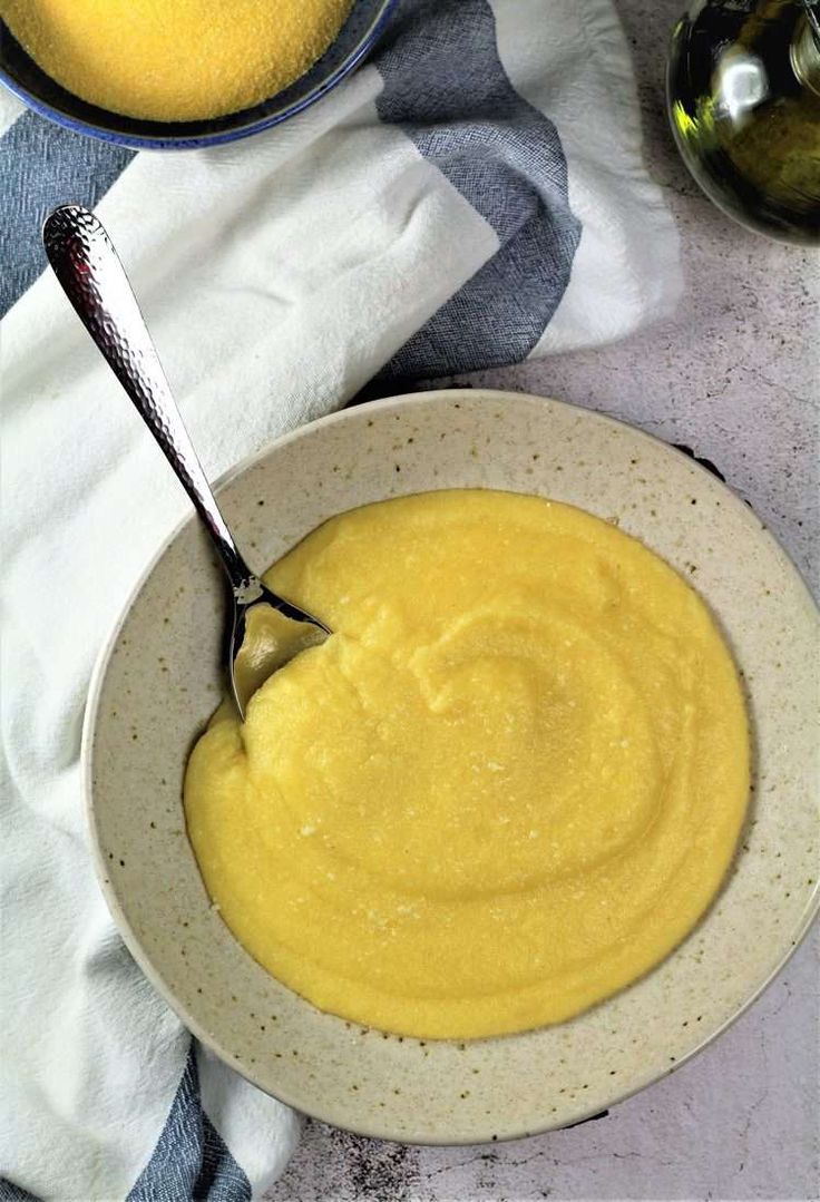 a bowl filled with yellow liquid next to two other bowls